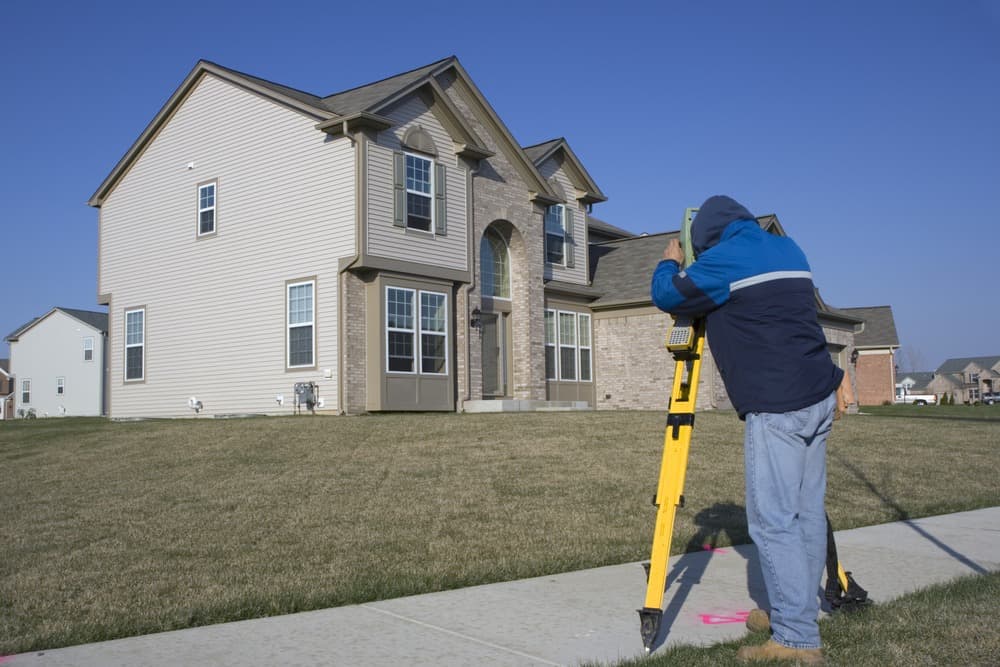 a person doing site survery for residintal home